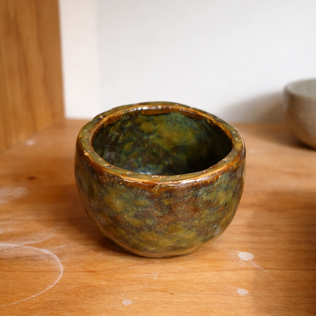 Handmade rustic ceramic egg cup with organic pinch-pot shape, custom glaze finish, neutral earthy tones, small batch pottery by Fields and Seas Phillip Island