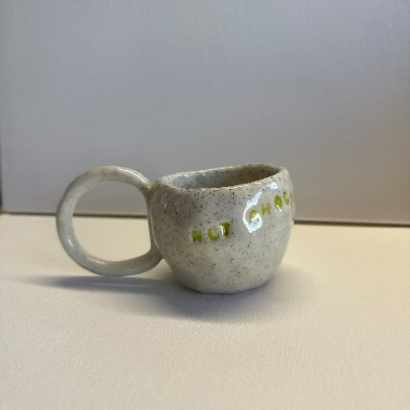 Close-up of a handmade clay cup created in a kids pottery class