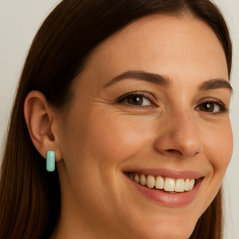 Woman wearing a turquoise blue Lagoon Bar Stud.