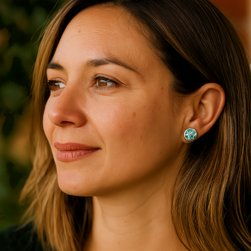 Porcelain sea pebble stud earrings on a model.