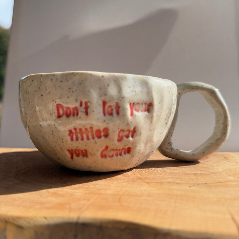 Handmade ceramic boobie cup with a natural glaze, designed in collaboration with Tash Robinson – 20% of sales donated to the Jane McGrath Foundation