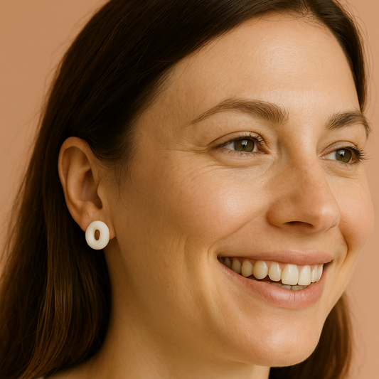 Handmade porcelain earrings – elegant white circle studs styled for everyday wear.
