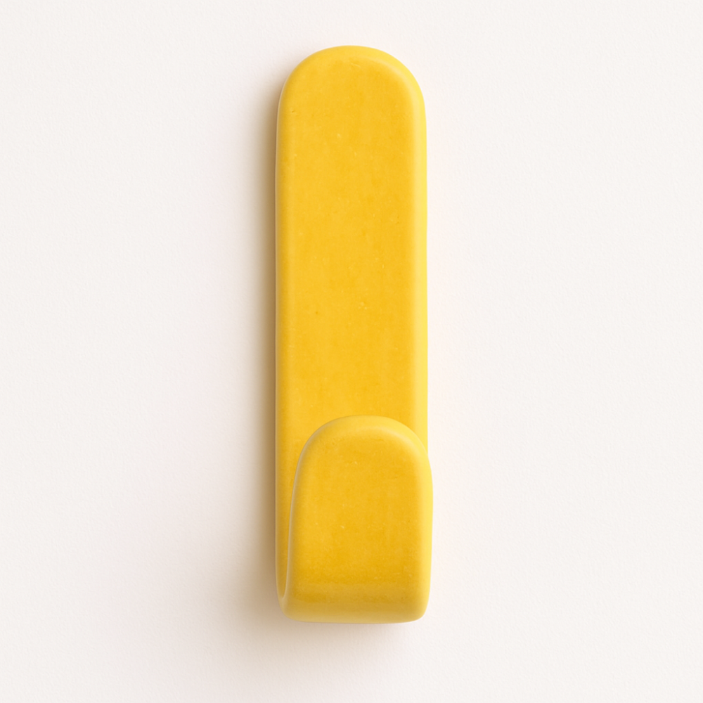 Yellow glazed ceramic wall hook on bathroom wall – part of the Colour Pop Collection.