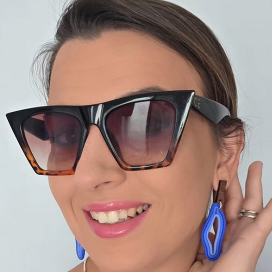 Blue polymer clay earrings, light and in the shape of waves.