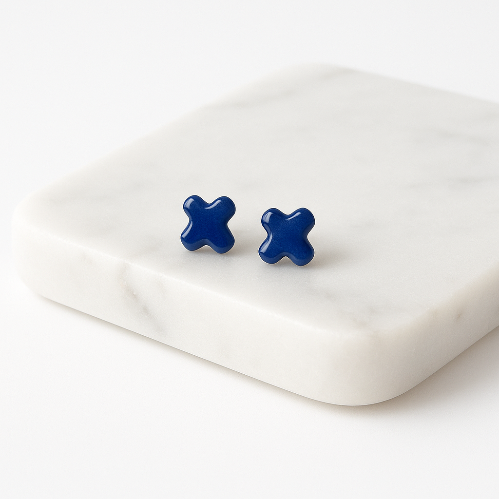 Cobalt blue porcelain cross stud earrings with clear gloss finish on white background