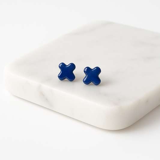 Cobalt blue porcelain cross stud earrings with clear gloss finish on white background