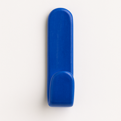 Ocean blue glazed ceramic wall hook on bathroom wall – part of the Colour Pop Collection.