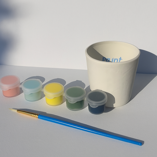 Cup, Glaze and Paint brush ready for ou to glaze and return for firing!