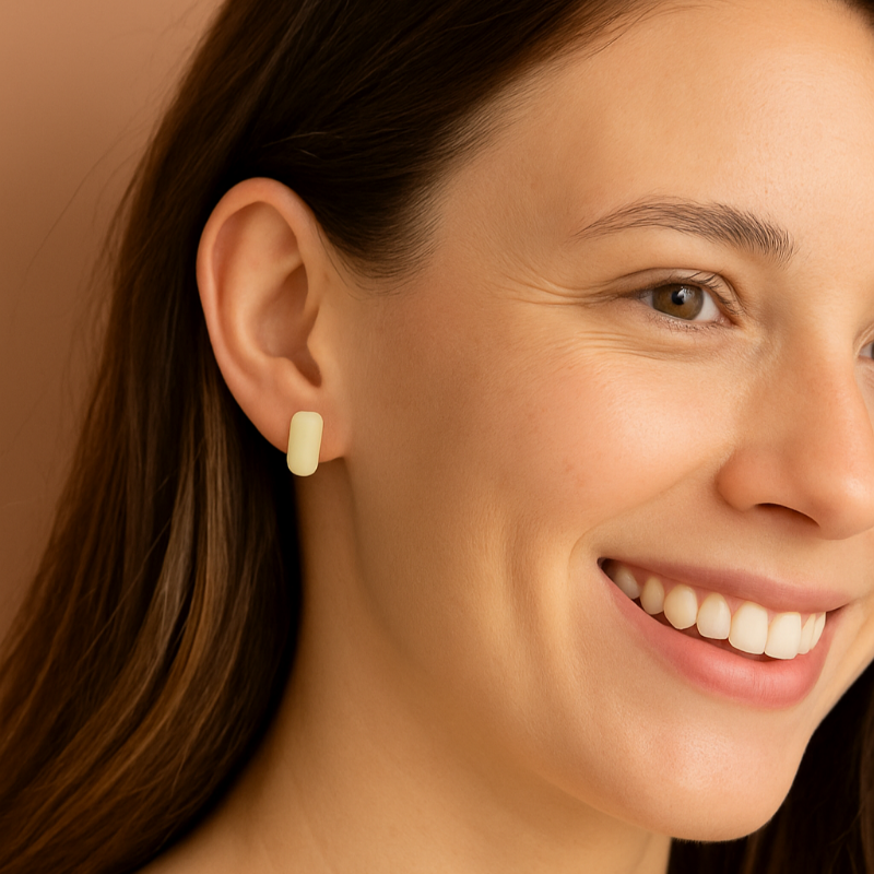 Women wearing white porcelain bar earrings.