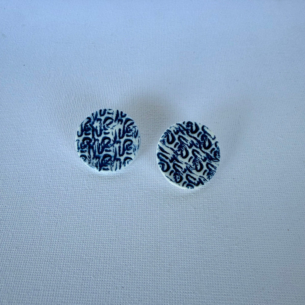 One-of-a-kind porcelain stud earrings with blue coral imprint texture
