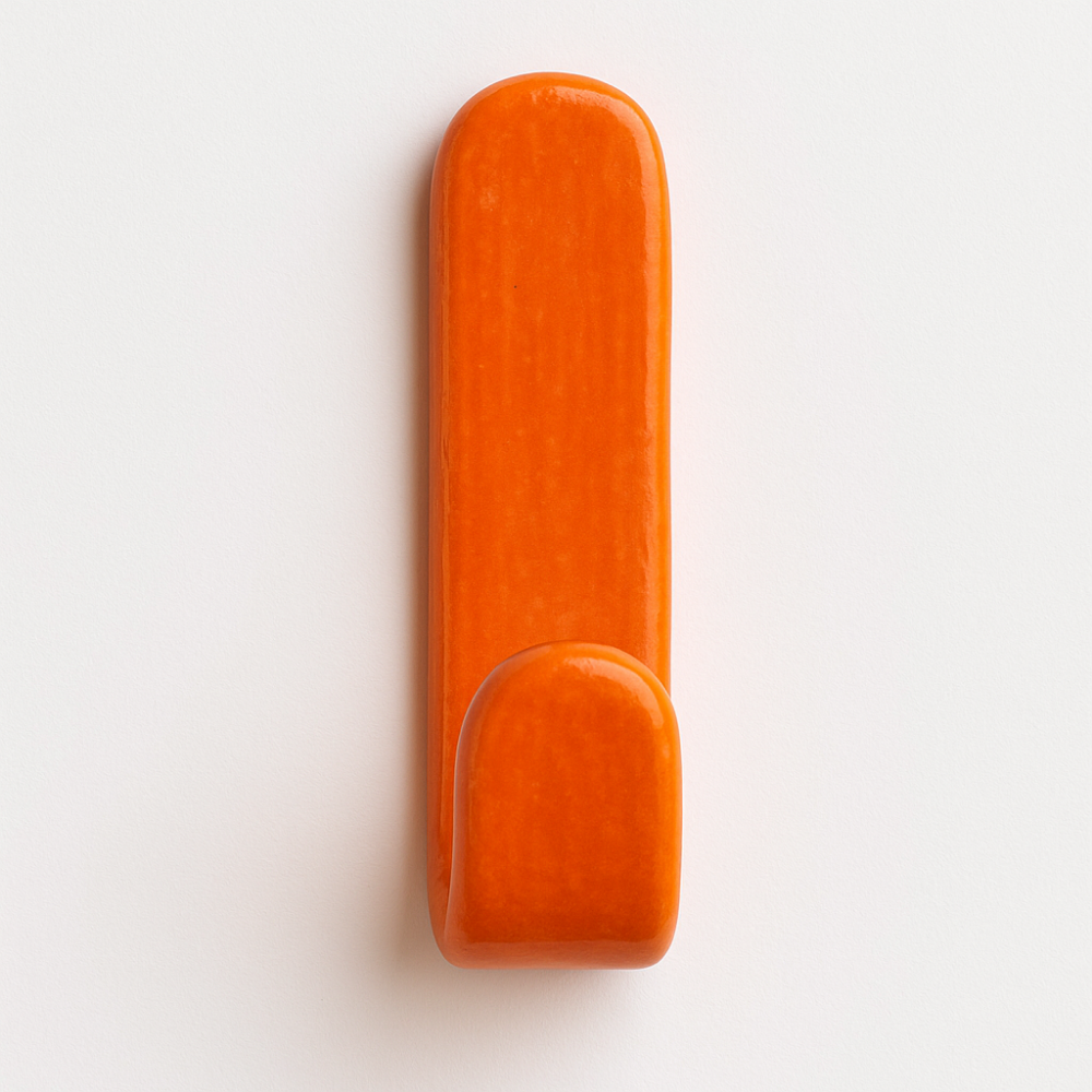 Hot Orange glazed ceramic wall hook on bathroom wall – part of the Colour Pop Collection.