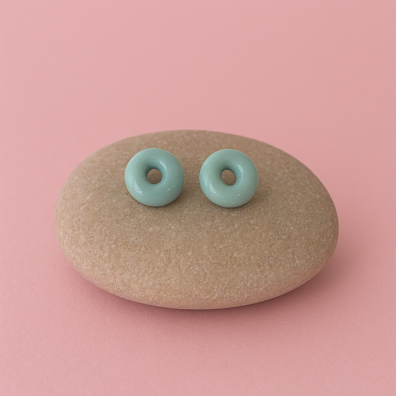 Lagoon turquoise blue porcelain circle stud earrings on river pebble