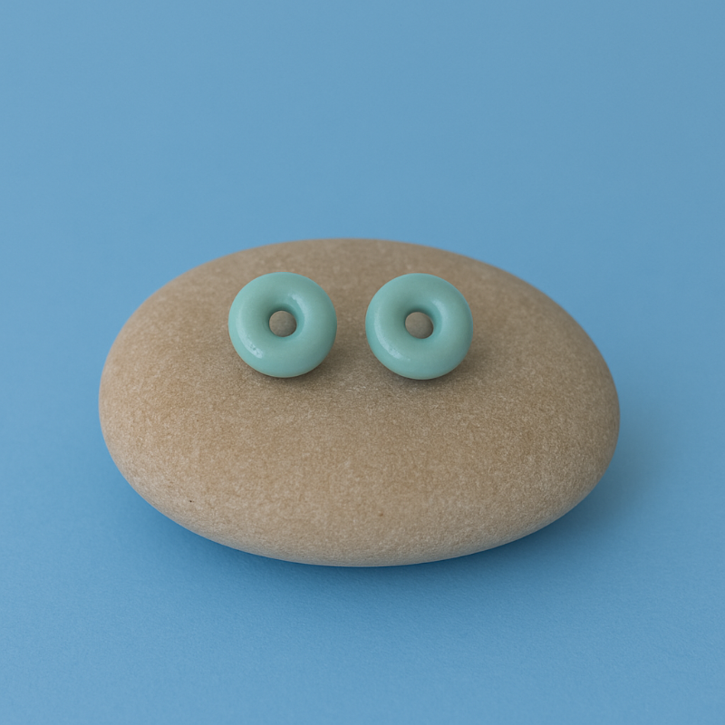 Lagoon turquoise blue porcelain circle stud earrings on river pebble