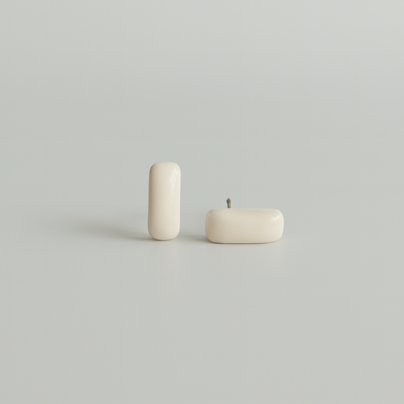 White porcelain bar studs that are part of the Tide and Form Collection