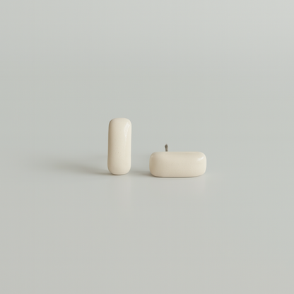 White porcelain bar studs that are part of the Tide and Form Collection