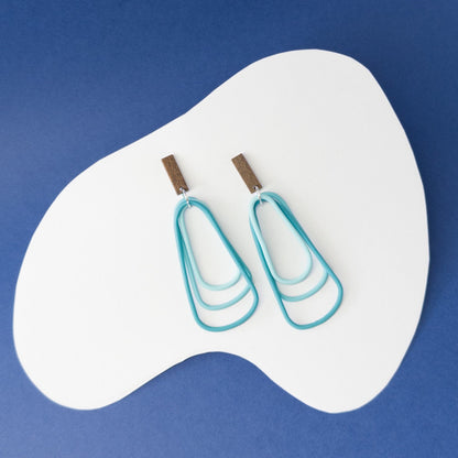 Vibrant teal dangles that echo the calm strength and beauty of ocean waters
