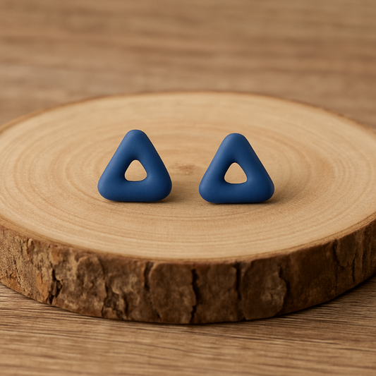 Close-up of triangular cobalt porcelain studs showing detail and texture