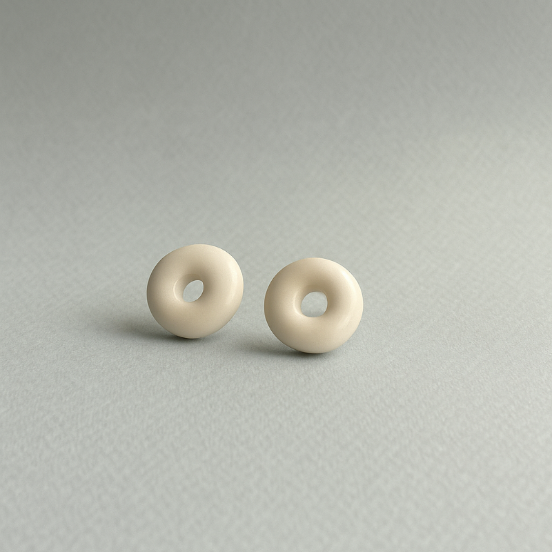 White porcelain stud earrings with clear glaze  - circles. Handmade by Fields and Seas