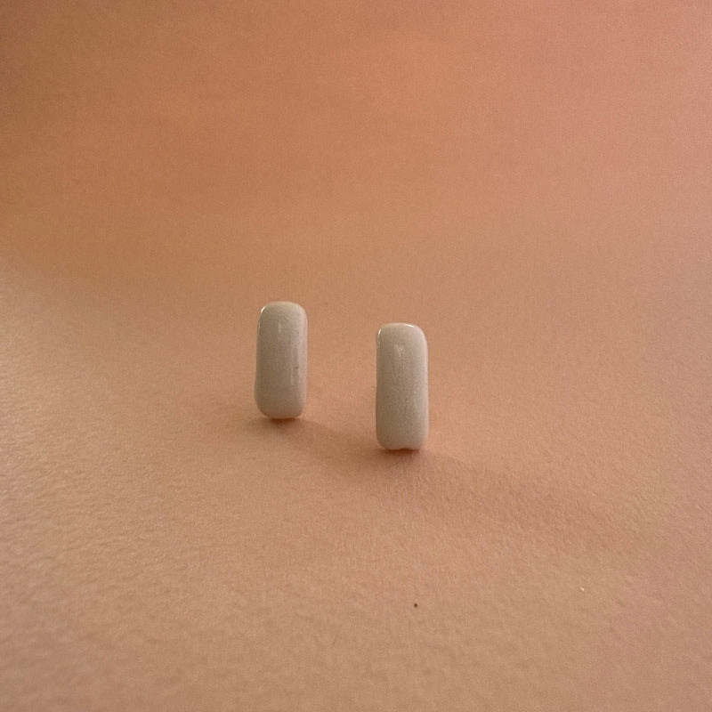 Two small rectangular objects on a beige surface
