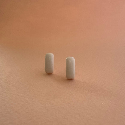 Two small rectangular objects on a beige surface