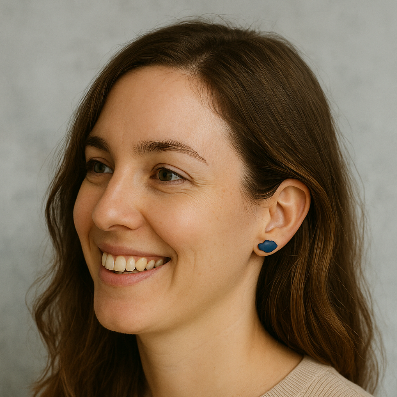 Lifestyle shot of woman wearing cobalt blue porcelain cloud studs in natural light