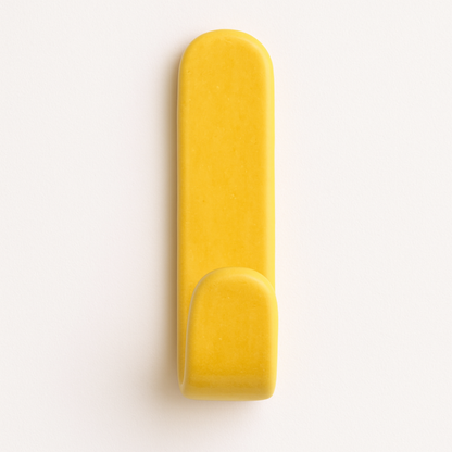 Yellow glazed ceramic wall hook on bathroom wall – part of the Colour Pop Collection.